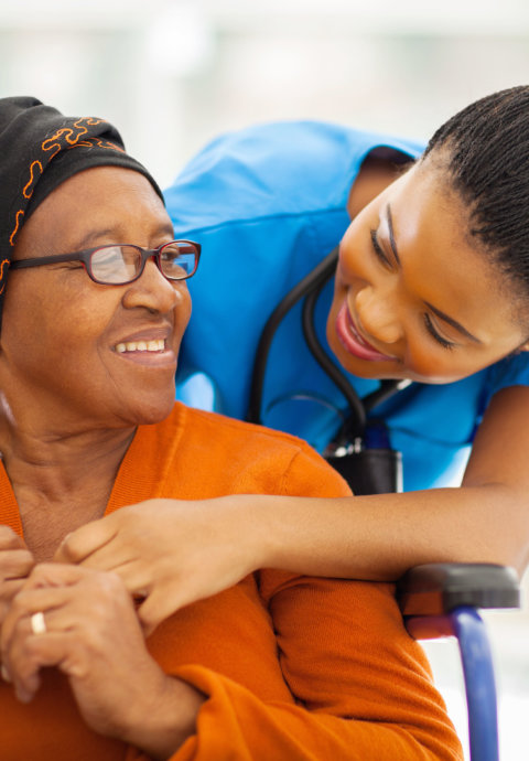 happy senior patient with friendly female nurse